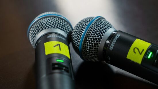 Two microphones used for a panel discussion.